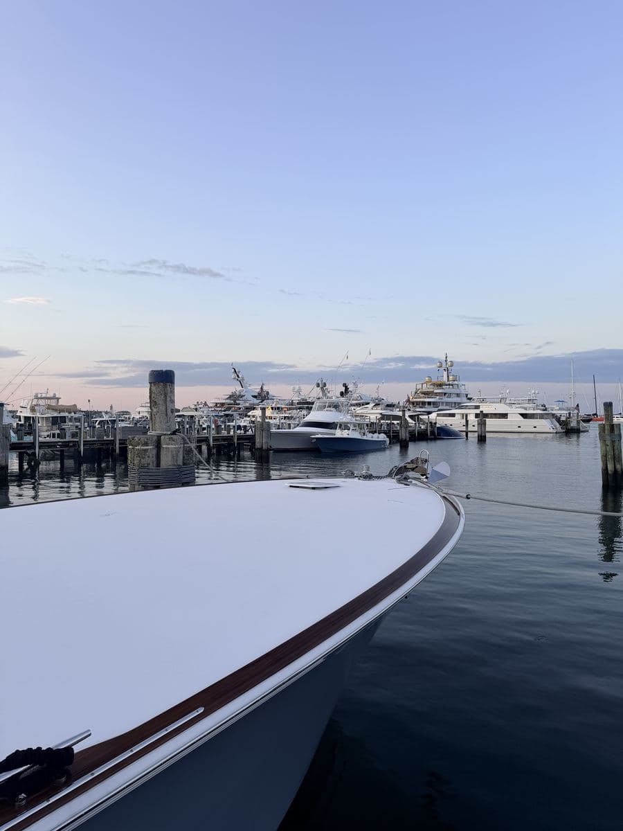 The bow of a boat looking out over a harbor