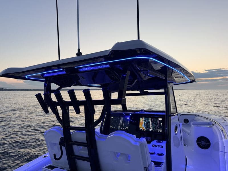 A boat T-top lit at dusk